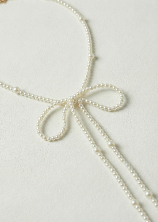 Long bow pearl necklace